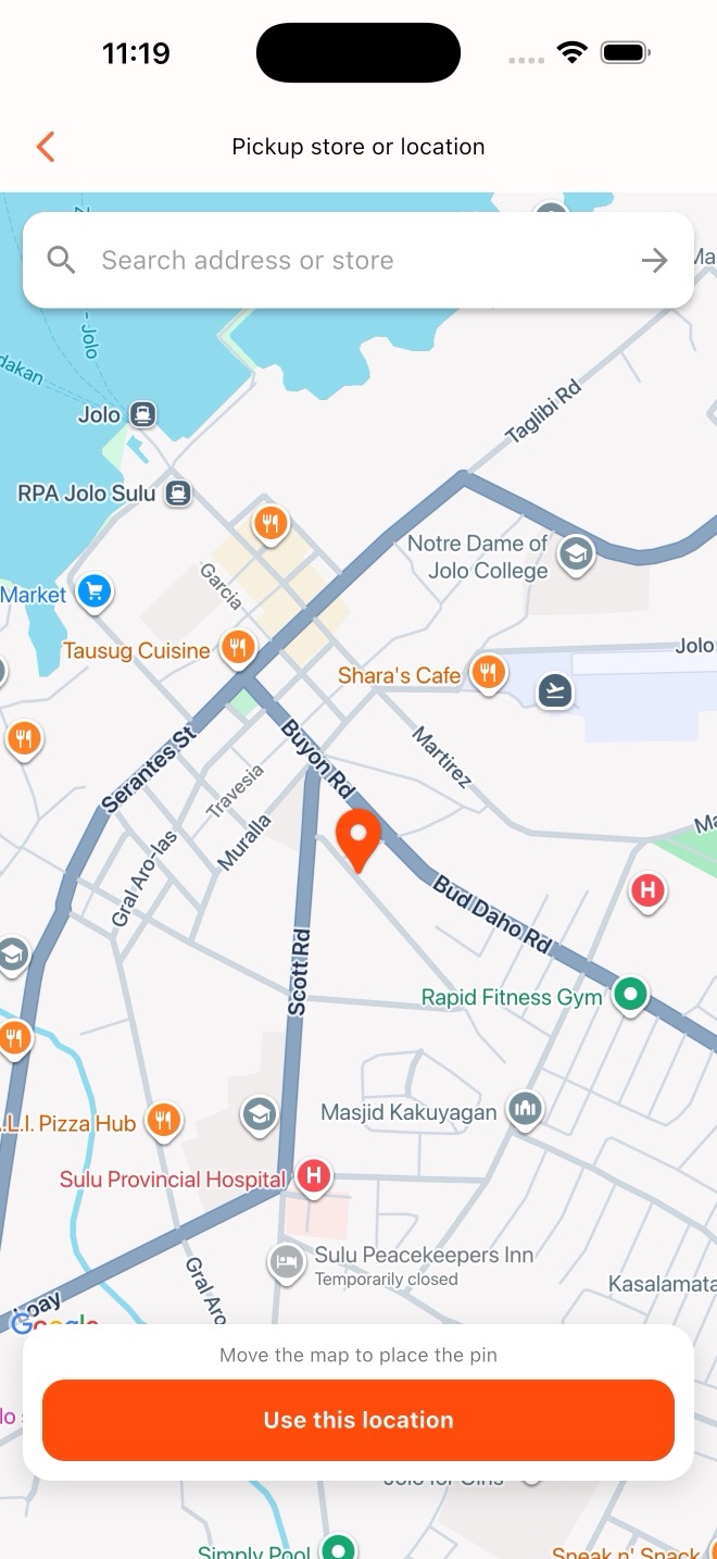 LalaGO mobile PAUTOS pickup screen with a Google Map, movable orange pin, address search, and Use this location button